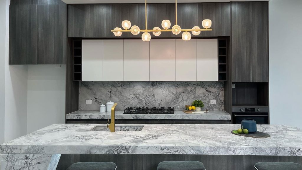 a kitchen with marble counter tops and a marble countertop